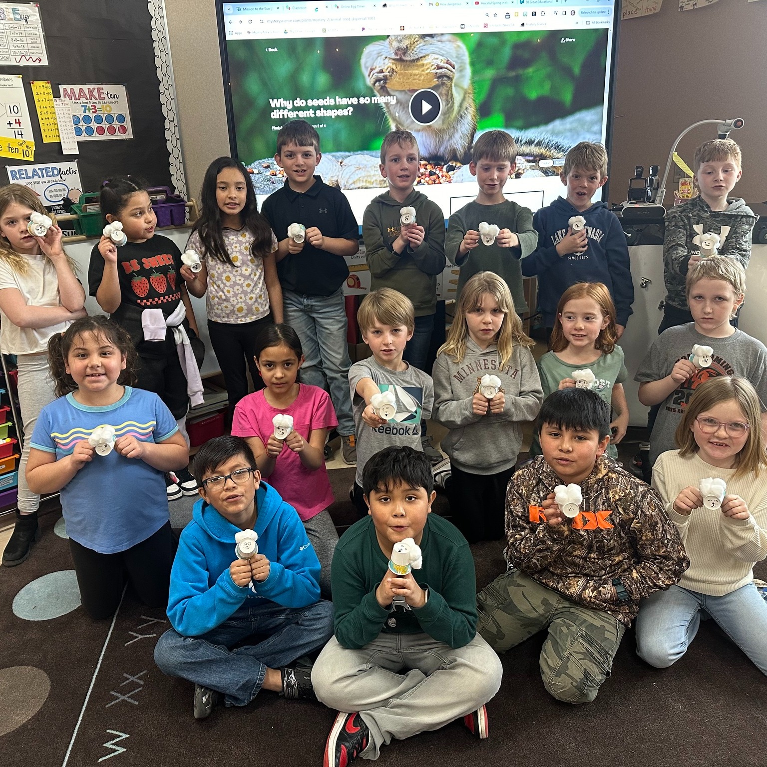 MAES 2nd graders show off their seeds they planted with the help of WCROC staff.